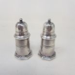 A pair of French white metal pepper pots, by Christofle, 8 cm high
