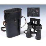 A pair of Kriegsmarine 7x50 binoculars, beh 438469, with bakelite eyepiece cover in a leather case