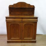 A 19th century rosewood chiffonier, the raised back above two drawers and two cupboard doors, on a