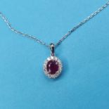 An 18ct white gold, ruby and diamond pendant necklace 5.6mm x 4.6mmm approx. , stone cloudy,