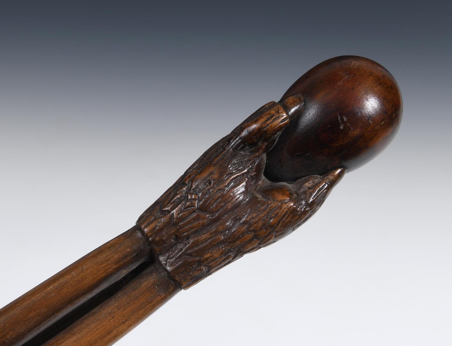 A 19th century folk art walking stick, the handle carved in the form of a talon gripping an egg, - Image 4 of 12