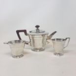 An Art Deco silver three piece tea service, with presentation inscription, Sheffield 1943, 34.0