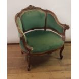 An early 20th century Continental walnut tub chair, on carved cabriole legs