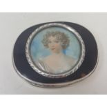 A silver coloured metal snuff box, the tortoiseshell cover inset with a portrait miniature of a