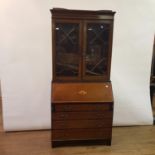 An early 20th century mahogany bureau bookcase, 90 cm wide, and a yew wood side cabinet, 110 cm wide