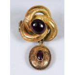 A 15ct gold and garnet brooch Report by JS Overall weight 8 g
