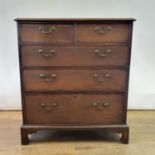 A 19th century oak and mahogany crossbanded chest, having two short and three long graduated