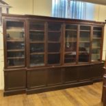 A library bookcase, the top with six glazed doors, on a base with six cupboard doors, 230 cm high