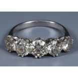 An 18ct white gold and five stone diamond ring, approx. diamond weight 3.34ct