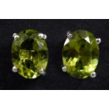 A pair of peridot stud earrings Each 8.2mm x 6 mm approx.