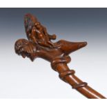 A 19th century folk art walking stick, the carved handle depicting Noah and animals, 93 cm