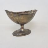 An early 19th century Irish silver pedestal bowl, of navette form, crested, and with engraved
