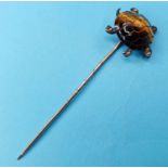 A yellow metal, enamel and diamond stick pin, in the form of a tortoise