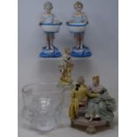 A pair of early 20th century Dresden figures, of a young boy and girl holding baskets, 22 cm high, a