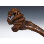 A 19th century folk art walking stick, with a carved handle in the form of a Mastiff type dog in the