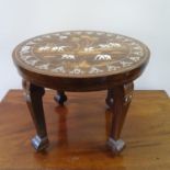 A rosewood, bone and marquetry inlaid low table, decorated elephants in a landscape, 46 cm diameter