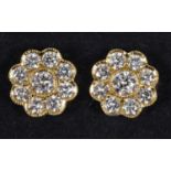 A pair of 18ct gold and diamond daisy style stud earrings Diameter 10mm