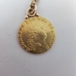 A George III guinea, 1878, mounted as a pendant, on a chain