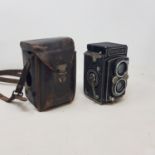 A Rolleiflex camera, with Carl Zeiss Jena Tessar 75mm lens, in a leather case