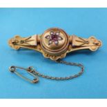 A 9ct gold, seed pearl and garnet target type brooch, boxed