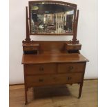 A 19th century mahogany chest, having two short and three long graduated drawers, on turned feet,