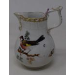 A Continental porcelain jug, decorated with birds and butterflies, small crack to spout, 12 cm