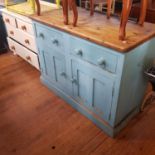 A painted pine dresser, having two drawers above two cupboard doors on a plinth base, 127 cm wide