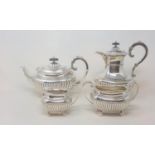A silver four piece tea and coffee service, of rectangular form with reeded lower bodies,