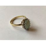 An 18ct gold, opal and diamond cluster ring, 3.5 g (all in)