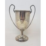 A silver two handled trophy cup, inscribed and dated 1912, Birmingham 1911, 9.3 ozt, 21 cm high