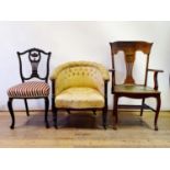 A 19th century mahogany button back tub chair, on oak armchair, and a walnut single chair (3)