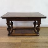 A 17th century style oak draw leaf table, on turned legs joined by stretchers, 246 cm wide (