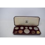 An Elizabeth II commemorative coin set, 1953, crown down, cased, and other assorted commemorative