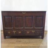 An 18th century oak mule chest, having a hinged top above two drawers, 130 cm wide