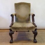 An 18th century style Gainsborough mahogany armchair, with foliate carved arms, on carved cabriole