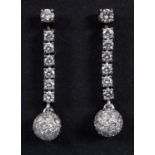 A pair of 18ct white gold, diamond drop earrings