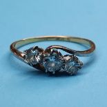 An 18ct gold and three stone diamond ring, ring size P