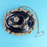 A 19th century yellow metal, jet and pearl memorial brooch, glazed back set with hair, engraving