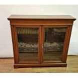 An early 20th century mahogany bookcase, on bracket feet, 121 cm wide Some loss of colour, various