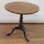 A George III mahogany table, on a turned column support and tripod base, 74 cm diameter