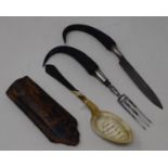 An 18th/19th century Continental travelling cutlery set, the knife and fork with steel blades,