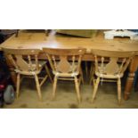 A pine kitchen table, 184 cm wide and six matching chairs (7)