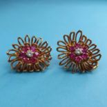 A pair of 18ct gold, ruby and diamond cluster earrings