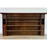 A 19th century oak dresser top, with a fret carved frieze, 229 cm wide