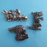 Three modern silver coloured metal brooches, in the form of dogs (3) Report by JS Note: this is