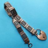 A 9ct gold fancy link bracelet, damaged, with a padlock clasp, 20.4 g