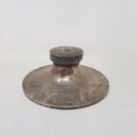 A silver capstan inkwell, initialled, and dated 1922, Birmingham, 16.5 cm diameter Some of the