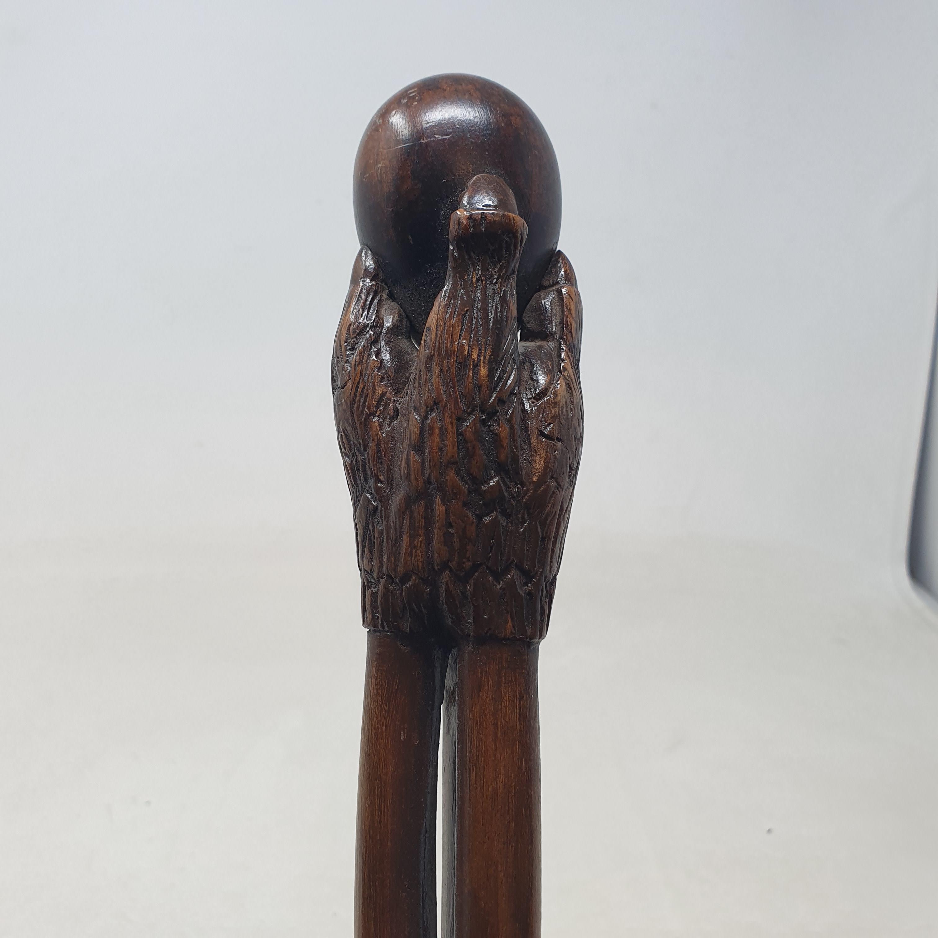 A 19th century folk art walking stick, the handle carved in the form of a talon gripping an egg, - Image 6 of 12