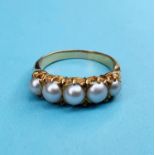 An 18ct gold and five stone pearl ring, ring size K