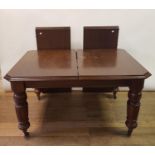 An early 20th century mahogany extending dining table, on turned reeded legs, 148 cm wide, with